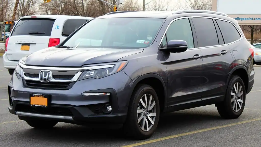 1. A 2019 Honda Pilot EX L parked in a parking lot in College Point Queens New York