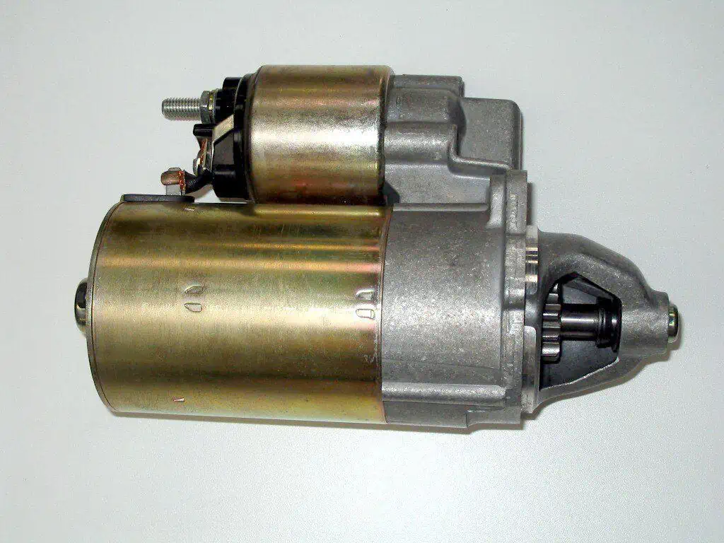 1. An automobile starter motor larger cylinder and the starter solenoid above it