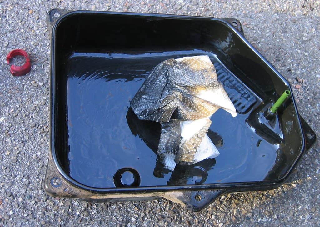 1. Oil pan of an automatic transmission with sedimented wear 1