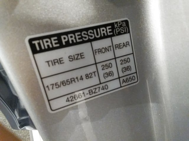 12. Car tire pressure sticker on car door