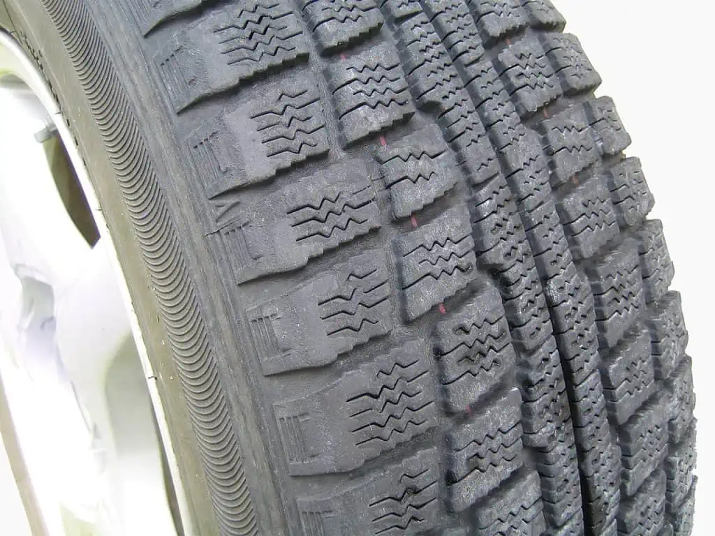 2. A winter tire without studs showing tread pattern designed to compact snow in the gaps