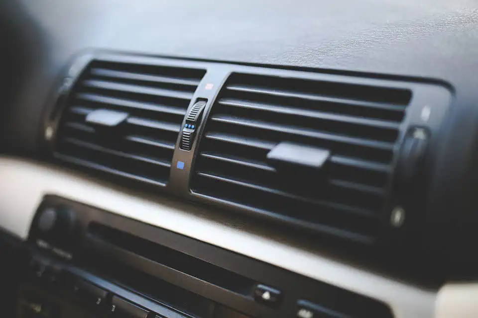 2. An automotive AC vents on the dashboard