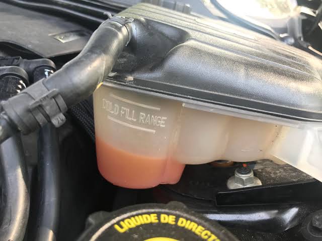 Car Overheating When Idle? 8 Reasons Why + How to Fix 3 3. Coolant reservoir showing low coolant level