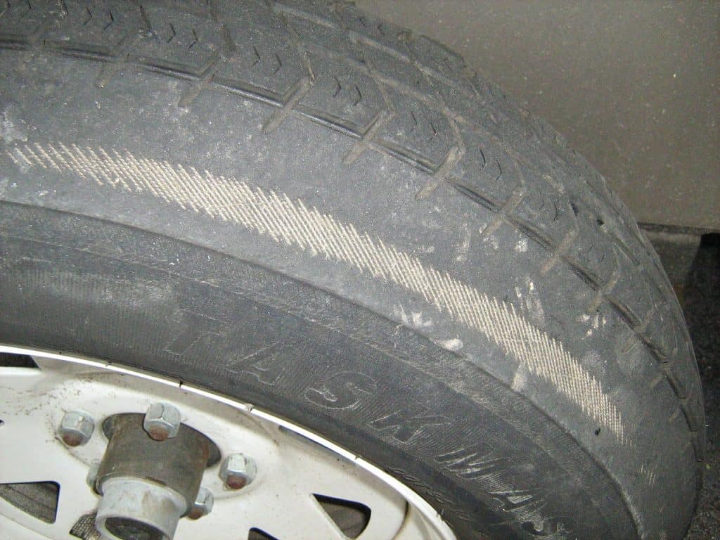 3. Tire showing uneven tread wear