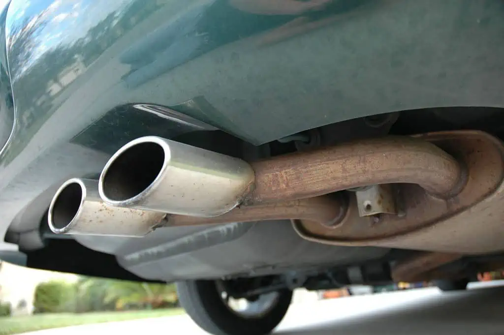 4. Dual tailpipes attached to the muffler on a passenger car to reduce the sound produced