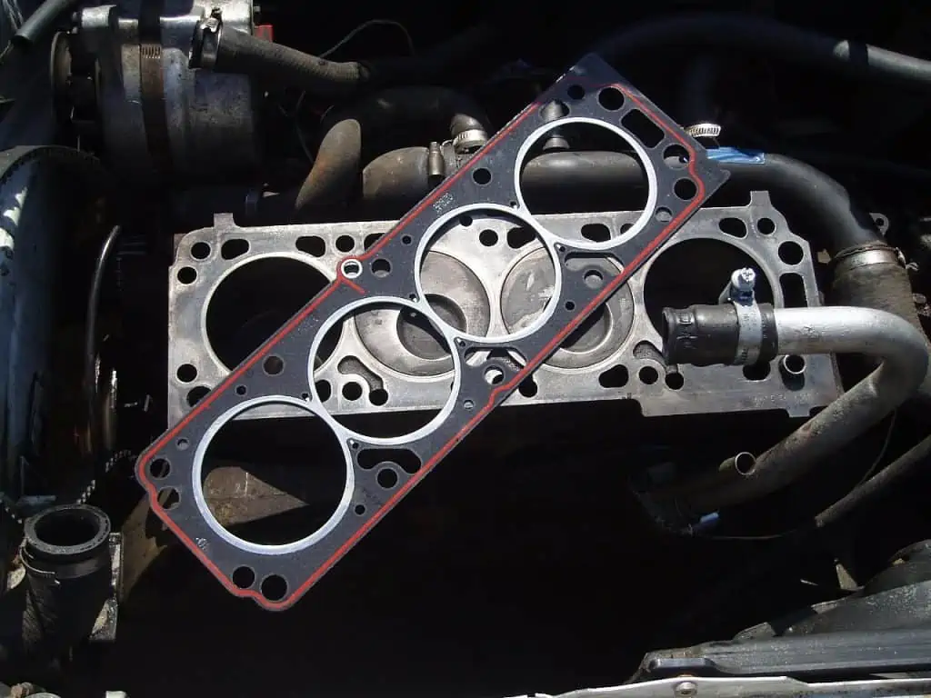 6. A head gasket in dark gray with a red border