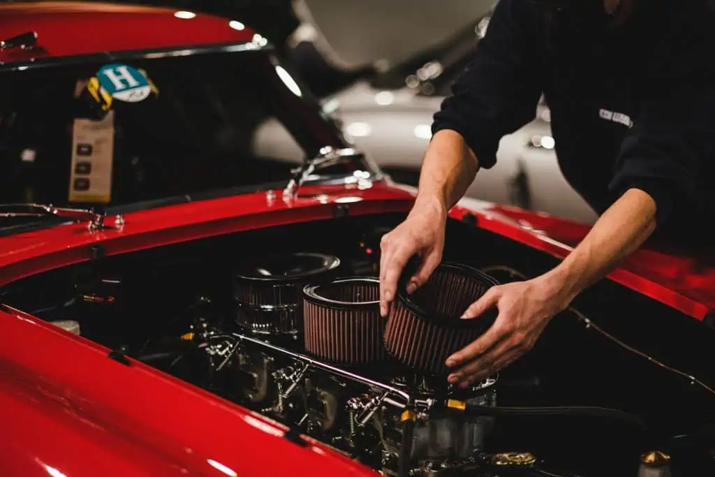 7. A Person Putting Air Filter in the Car