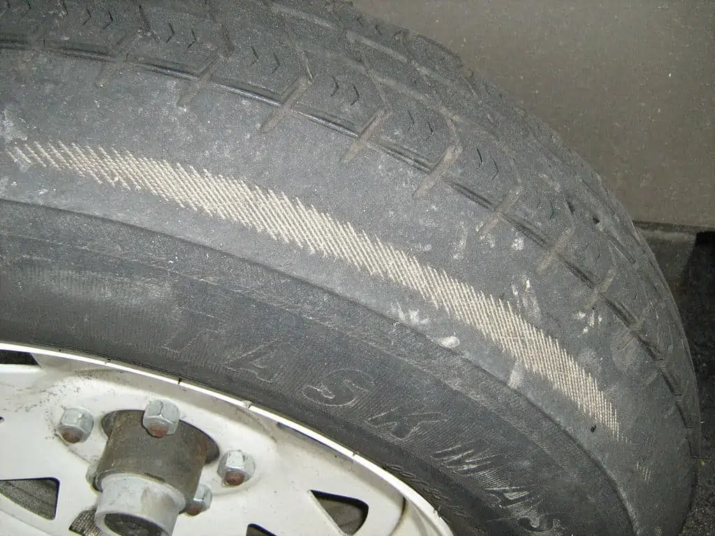 8. Tire showing uneven tread wear